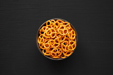 Mini Pretzels with Salt in a Bowl, top view. Flat lay.