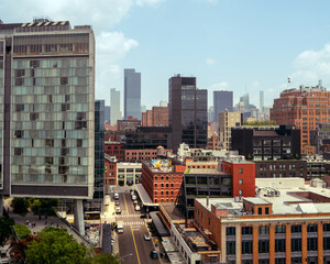 Manhattan, New York City, Meat Packing District overlooking Greenwich and west village in bright, warm and cinematic daylight. Skyscrapers and traditional American red brick buildings © andrew