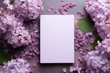 Wandcirkels aluminium mockup white blank paper sheet with lilac flowers top view, floral template empty card flat lay for design with copy space © Маргарита Вайс