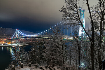 Lions Gate Bridge, Stanley Park, Vancouver, British Columbia. Long Exposure at night in winter with snow.