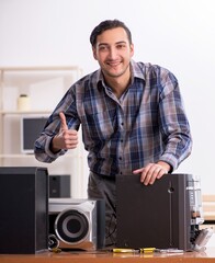 Young engineer repairing musical hi-fi system