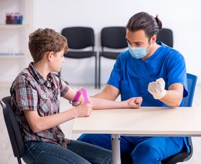 Young boy visiting doctor in hospital