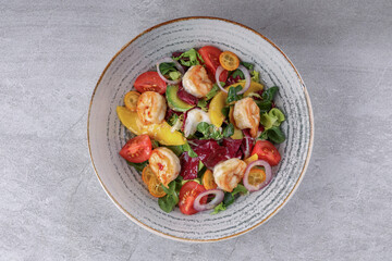 bowl with avocado shrimp and kumquat on stone background, studio food photography 3
