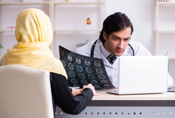 Female arab patient visiting male doctor