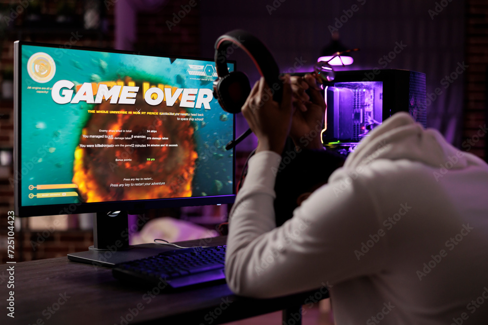 Poster gamer upset after losing online multiplayer action videogame tourney, being defeated by other player