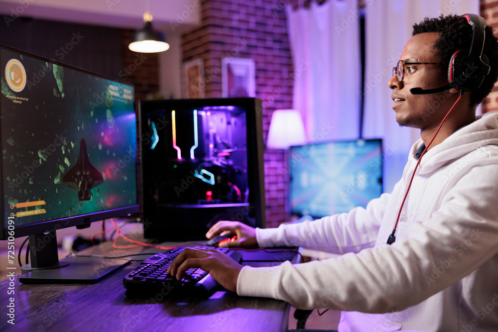 Poster gamer playing classic arcade space videogame, doing flying maneuvres through asteroid clusters. afri