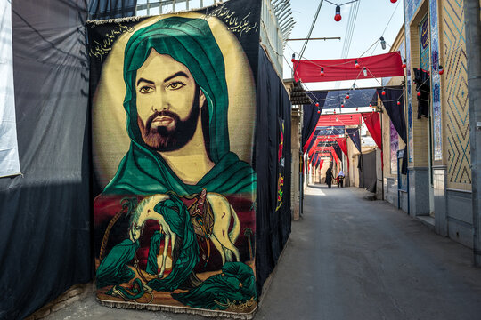 Kashan, Iran - October 18, 2016: Portrait of Imam Husayn ibn Ali during Muharram month on a street of Old Town in Kashan