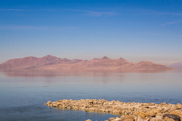 Mountains reflected in the Great Salt Lake outside of Salt Lake City, Utah, US.