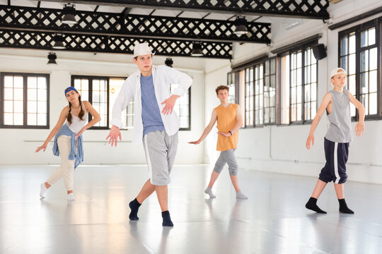 Group of teenagers dancing shuffle and swing dances