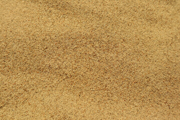 Fototapeta na wymiar Sea sand as background. Texture and abstract