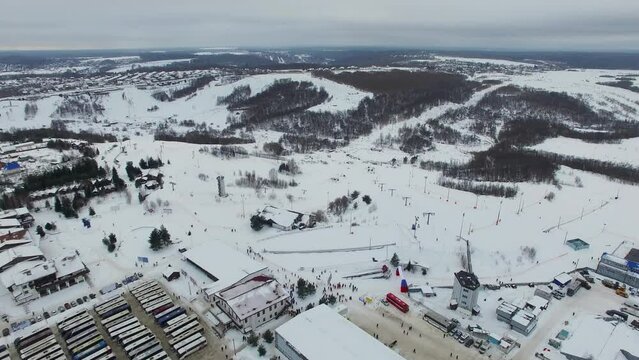 Landscape with ski base and many buses on parking during Lyzhnia Rosii race