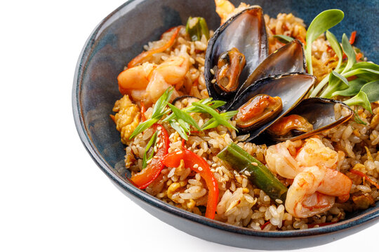 Hibachi rice with seafood on white background studio food photo 2