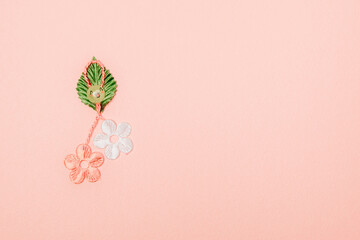 One beautiful floral martisor on a pink background.