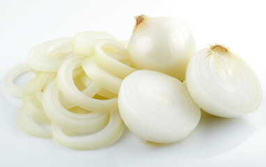 A close-up image showcasing fresh white onions, both whole and sliced, arranged aesthetically against a white background.