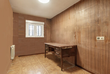 A gloomy room with brown walls