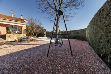 A children's swing on a private plot