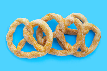 Soft pretzels on a blue background.