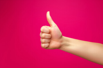 Thumbs up gesture in studio, advertising concept. Background with selective focus and copy space