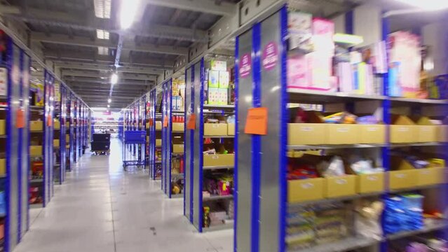Many shelves with goods in Ozon company logistic center