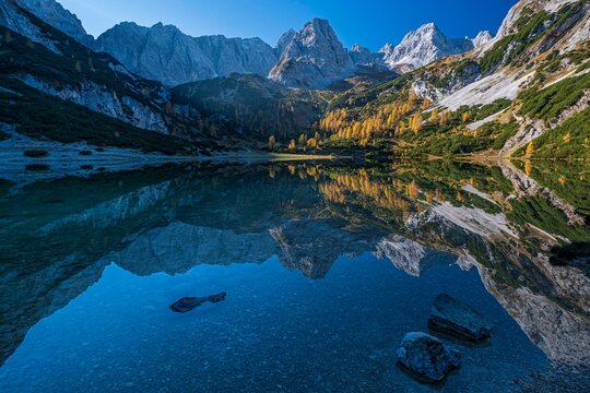 Mountains reflected in mountain lake, sun, autumn, Seebensee, Mieminger Kette, Tyrol, Austria, Europe