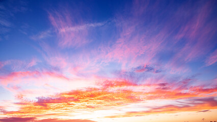 Sunrise background. Dramatic sunset background. Sky with clouds in Sunrise sky light background. Sunrise with clouds in various shapes background. Calm Sunrise.