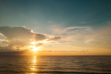 Cloudy sky on sea sunset, sunrise on ocean beach. Sunset landscape in the sky after sunset. Sunrise with clouds of different colors against the sky and sea.