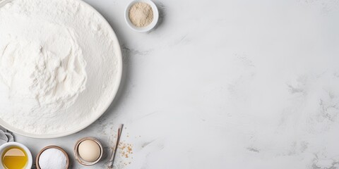 Top view mockup of baking ingredients and kitchen supplies on a bright grey background for cookies, pie, or cake recipes.