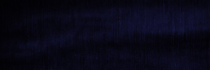 Panoramic surface of navy blue fabric denim grunge texture. Wallpaper, banner, background design images Blank copy space Close-up