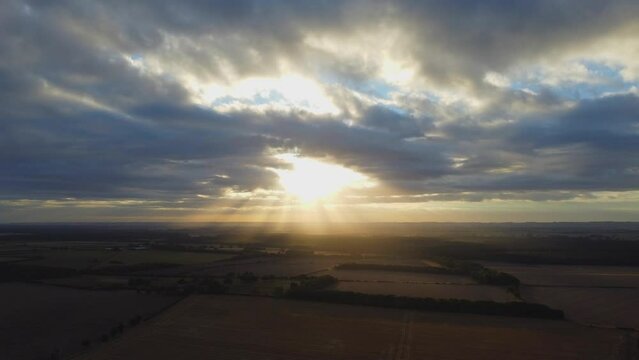 Aerial timelapse of sunrise in the field.