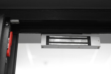Electromagnetic door lock indoors, closeup. Home security