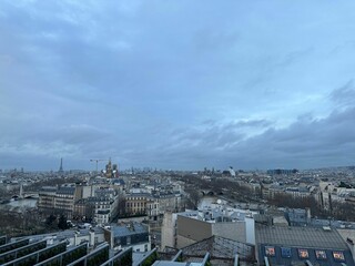 Obraz premium Beautiful buildings in Paris on cloudy day, view from hotel window