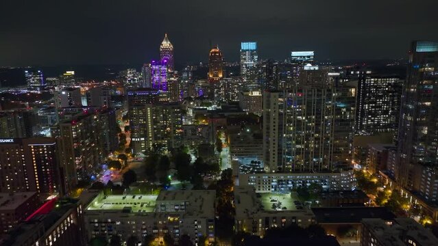Aerial view of downtown district of Atlanta city in Georgia, USA. Brightly illuminated high skyscraper buildings in modern american midtown