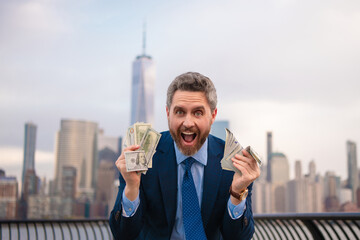 Money business. Business man hold money dollars in New York. Businessman with dollar outdoor....