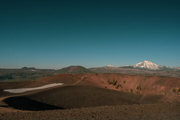 Clear Sky Over Cinder Cone Wtih Lassen Peak In The Distance