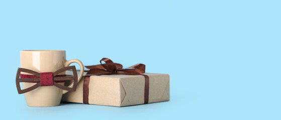 Greeting card for Happy Father's Day with bow tie, cup and gift