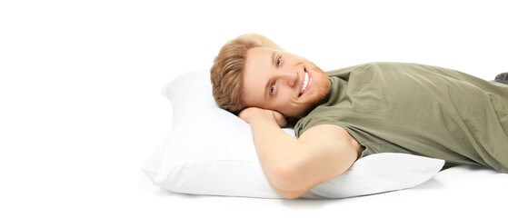 Lying happy man with pillow on white background