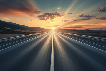Naklejka premium Wide shot of an empty highway during sunset.