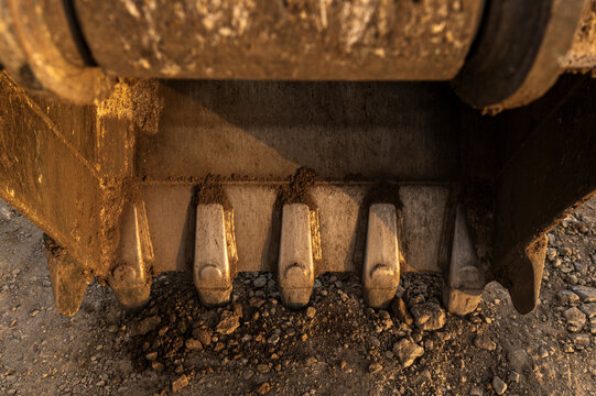 Close-up of excavator bucket at construction site