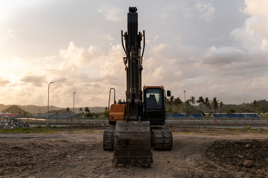 Development in progress, excavator on a construction site