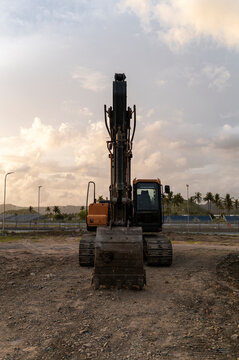 Development in progress, excavator on a construction site