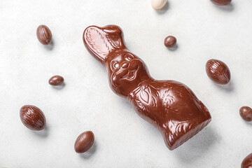 Chocolate Easter bunny with eggs on white background