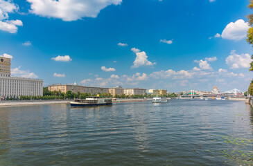 Fototapeta premium Cruise ship sails on the Moscow river in Moscow city center, popular place for walking.