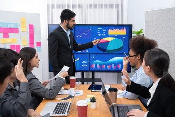 Businessman presenting data analysis dashboard display on TV screen in modern meeting for marketing strategy. Business presentation with group of business people in conference room. Concord