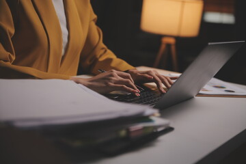 Business woman using calculator for do math finance on wooden desk in office and business working...