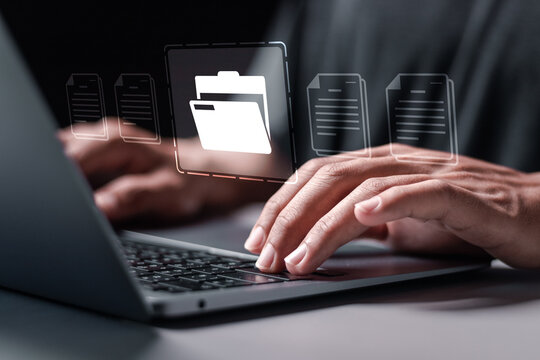 Search and manage document database files online. Person using laptop with virtual document management system for online document database and automated processes in file management.