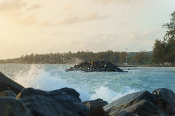 Rock bridge Breakwater Work for Wave Protection or Shoreline Beach Erosion Control, Revetment, Coastal Engineering Structure, Waves that hit the shore violently.