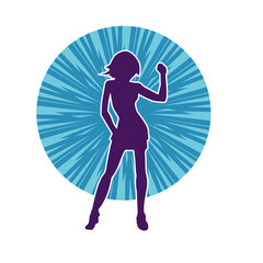 Silhouette of a female dancer wearing mini skirt in action pose. Silhouette of a slim woman dancing happily.