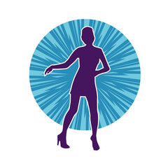 Silhouette of a female dancer wearing mini skirt in action pose. Silhouette of a slim woman dancing happily.