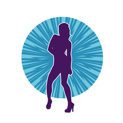 Silhouette of a female dancer wearing mini skirt in action pose. Silhouette of a slim woman dancing happily.