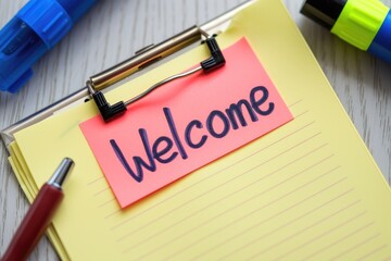 Welcome message written on a post-it note